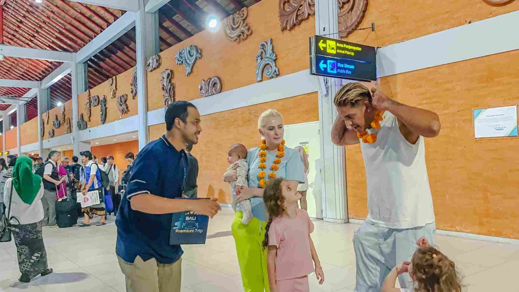 Airport greeter welcoming arriving guests, Ngurah Rai arrivals hall